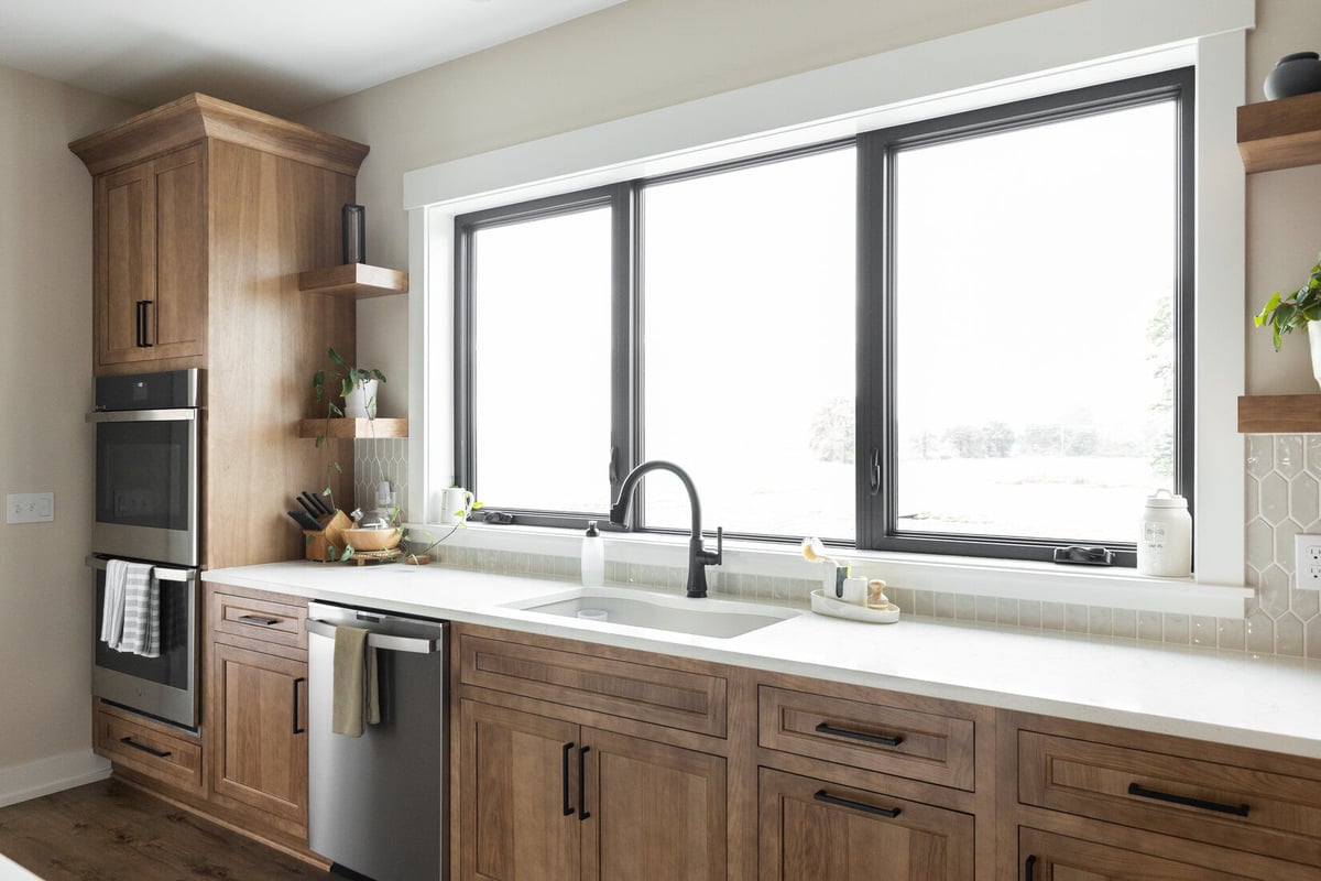 Kitchen sink area with large window and natural light in Ridgewood Home Construction’s West Michigan main floor remodel