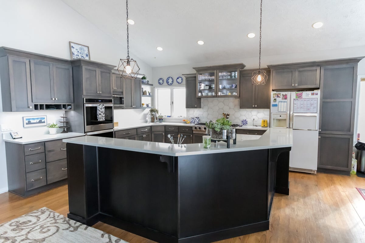 Spacious Cascade kitchen remodel with dark cabinetry and island by Ridgewood Home Construction