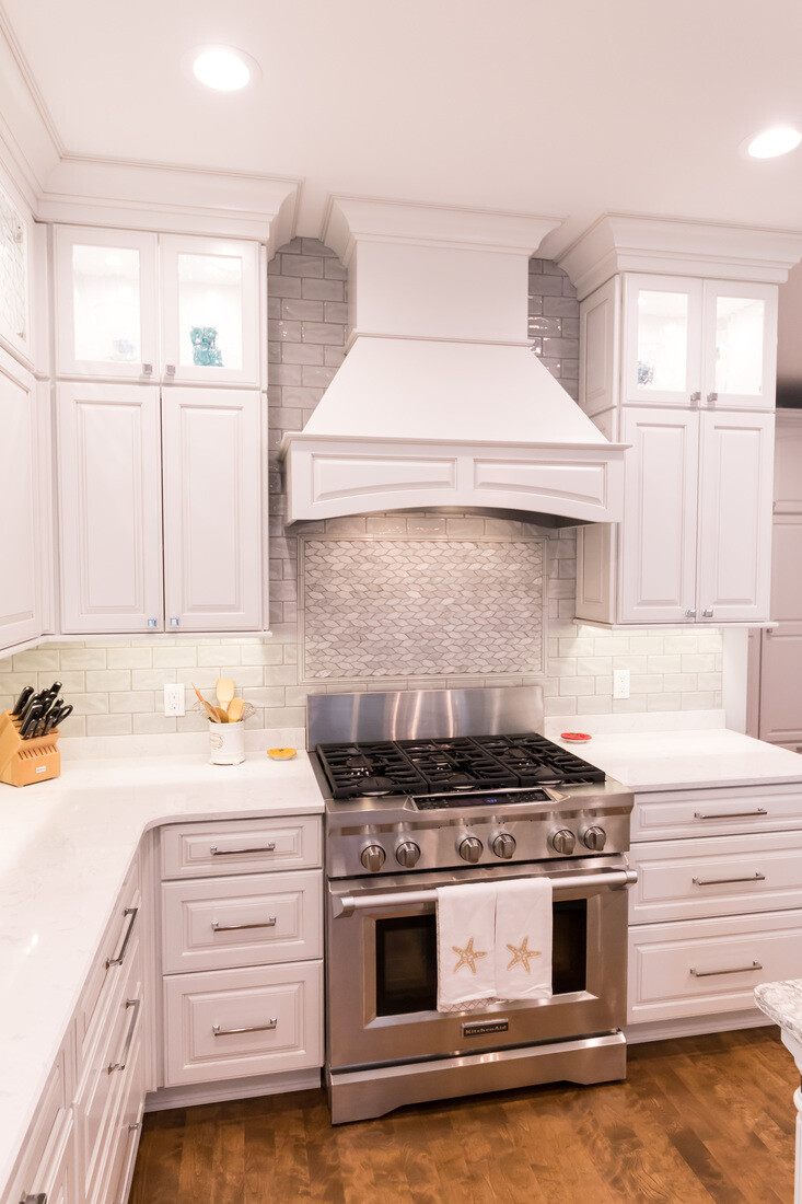 Close-up of luxury range and tile backsplash in Ridgewood Home Construction kitchen remodel