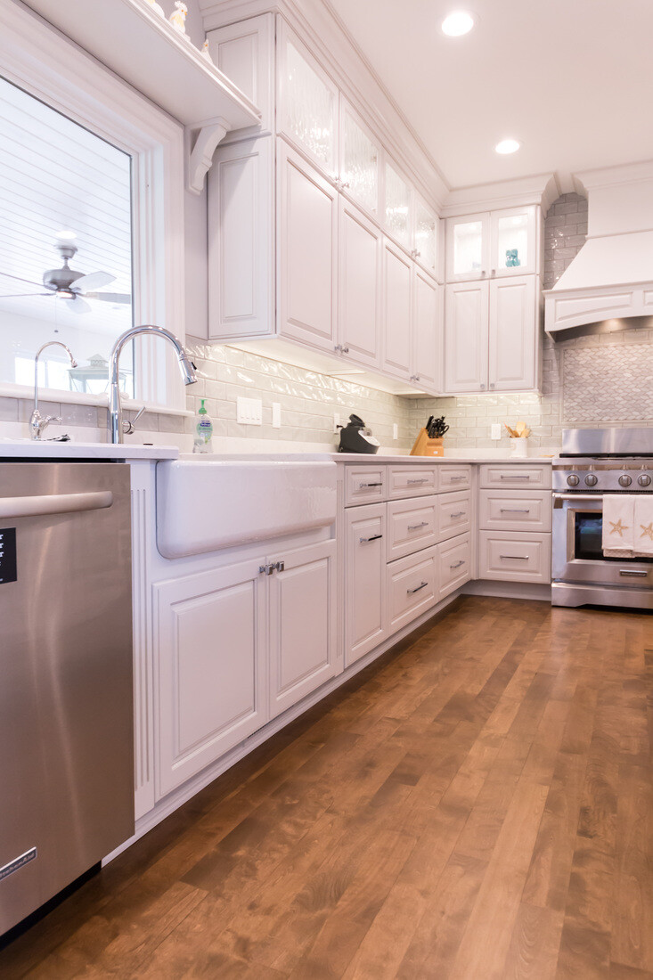 Kitchen remodel with farmhouse sink and stainless dishwasher by Ridgewood Home Construction in Grand Rapids Township