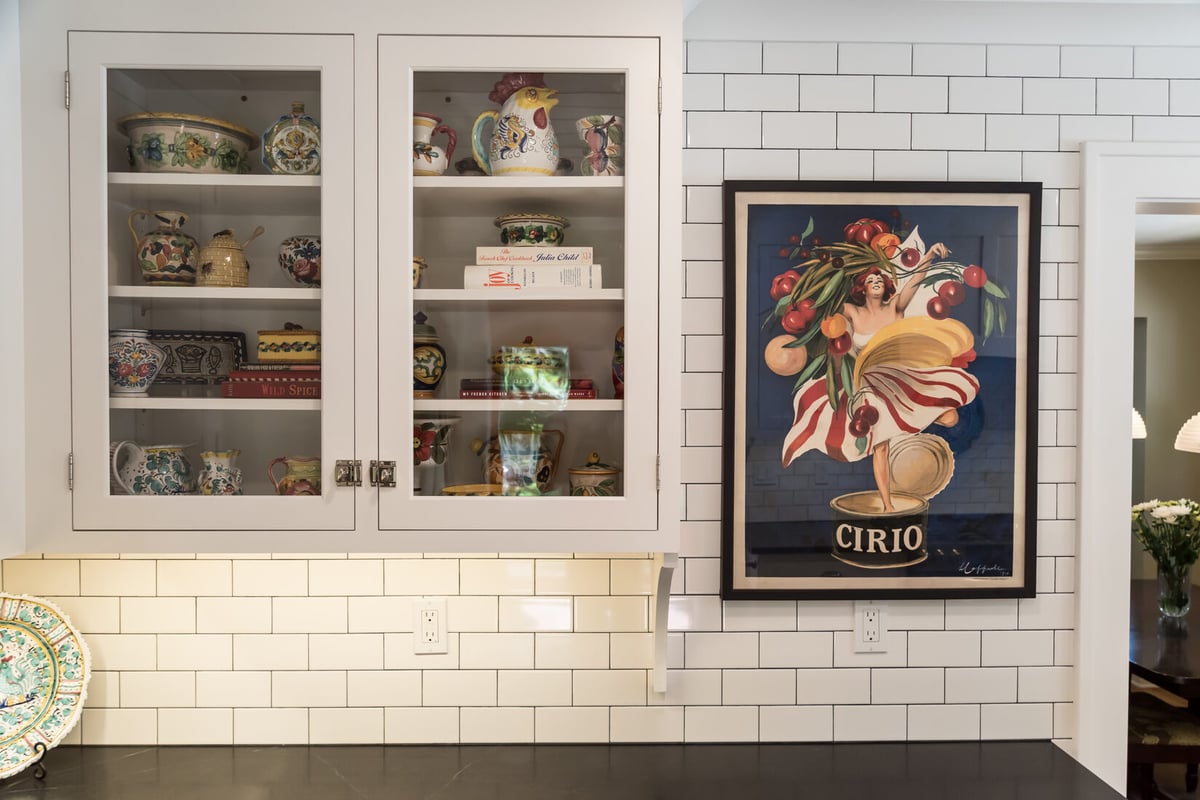 Decorative cabinet display with vintage ceramics in Ridgewood Home Construction Rockford, MI kitchen remodel