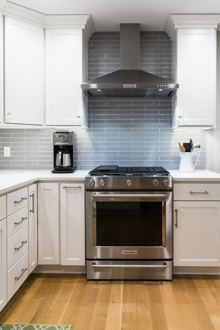Centered view of stainless range and hood in Rockford, MI kitchen remodel by Ridgewood Home Construction