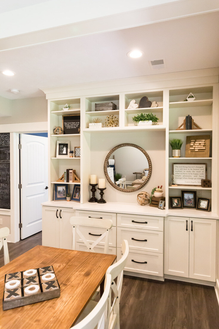 Custom built-in shelving with decorative accents in Sparta, MI basement remodel by Ridgewood Home Construction