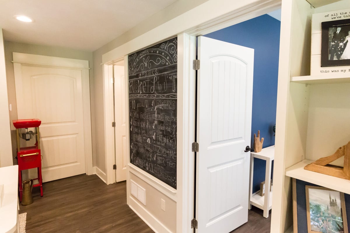 Hallway with chalkboard wall and popcorn machine in Sparta, MI basement by Ridgewood Home Construction